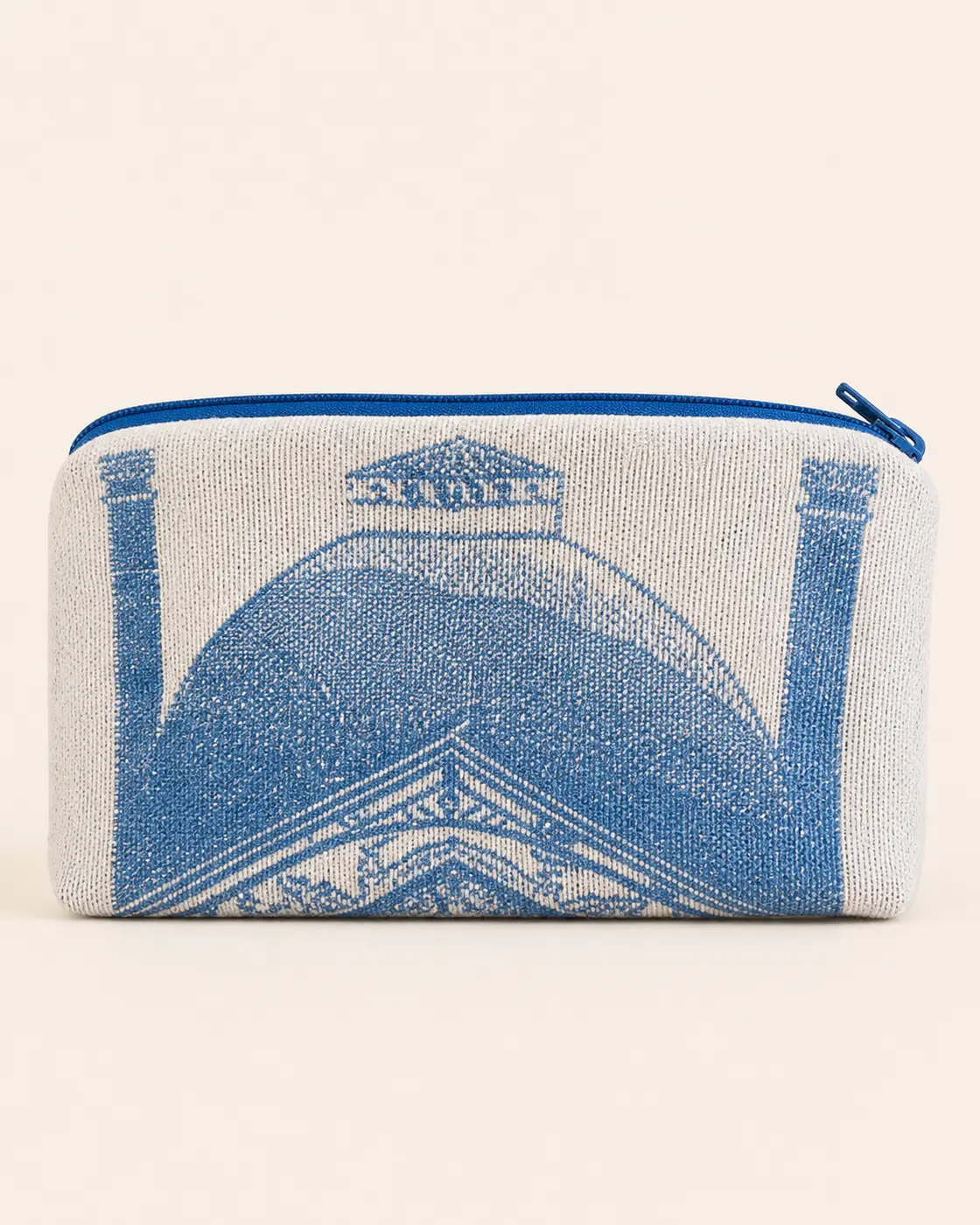 Front of a blue and cream pouch made from the central architectural motif of the Yves Delorme jacquard tea towel